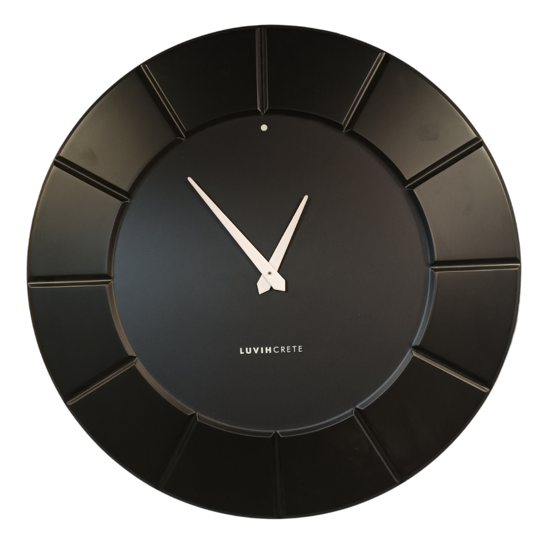 Black HDMR wall clock displayed in modern interior setting